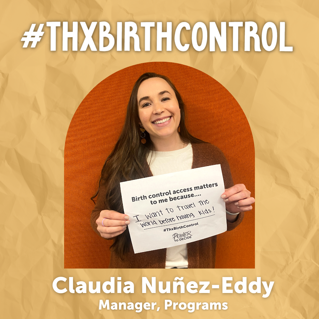 A Power to Decide Staffer holds a sign with their reason for saying #ThxBirthControl.