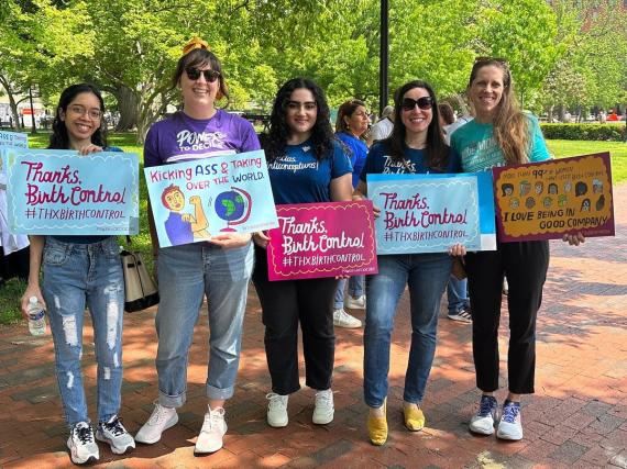 A group of Power to Decide staff hold signs that say "Thanks, Birth Control"